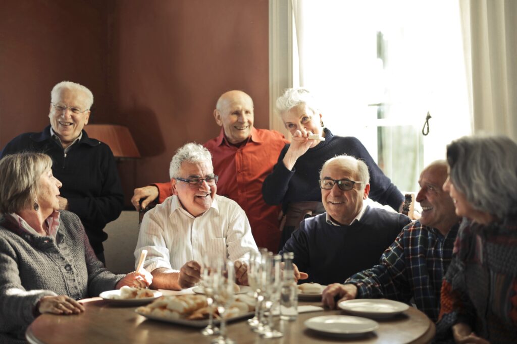 Group of friends enjoying chatting and eating together