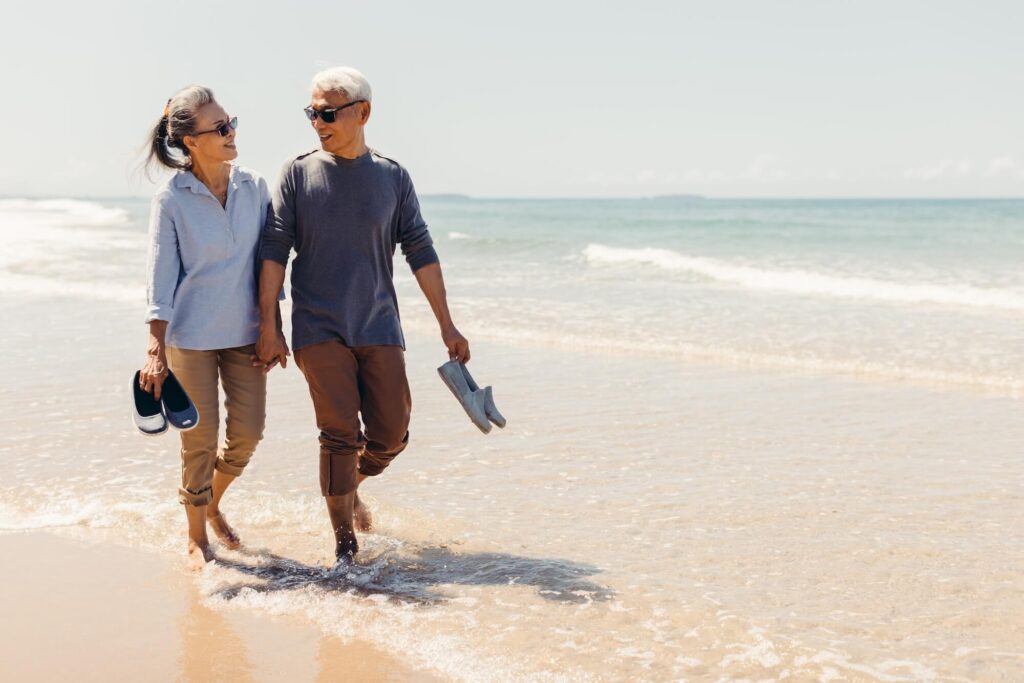 Couple enjoying their walk on the beach together
