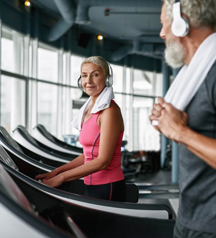 Couple enjoying exercising in the gym together