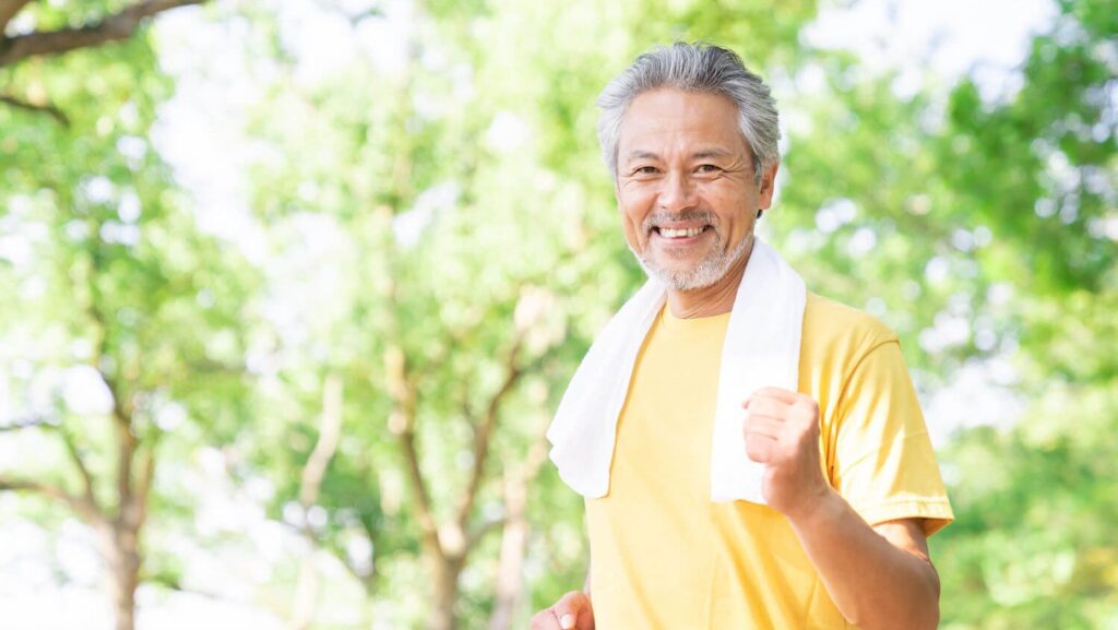 Elderly gentlman enjoying a run in nature