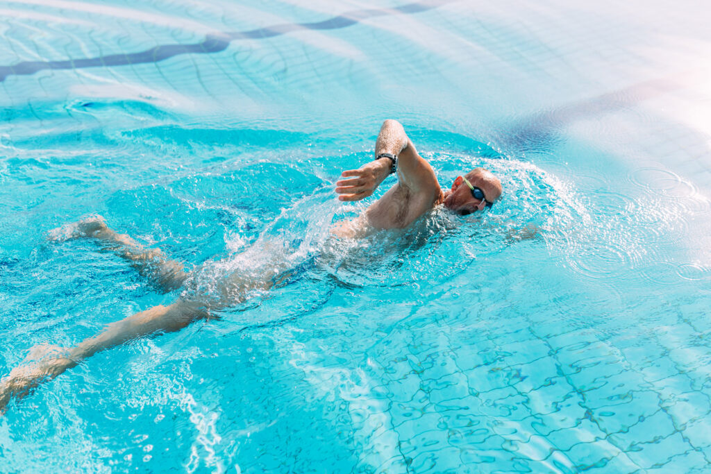 Marston Living resident swimming in the on site pool